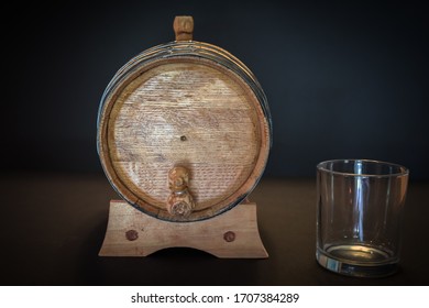 A Small, Oak Bourbon Barrel That Is Used To Age Bourbon Whiskey On A Black Background. Typically Corn Whiskey Is Used In The Barrels To Make Bourbon. Bourbon Making Is A Tradition In Southern US.