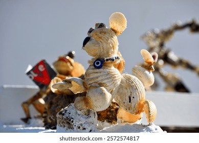 small object made of shells depicting a small dog albufeira portugal