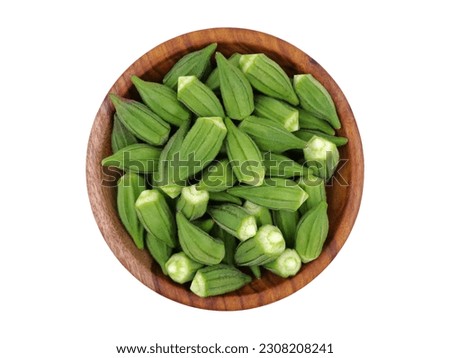 small okra, fresh Egyptian okra small size in wooden bowl isolated on white background top view