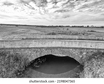 Small And Old Bridge In The Tuscan Countryside.