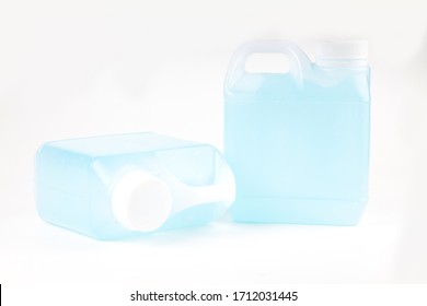 Small, Opaque White Gallon With Handle. Inside Is An Blue Alcohol Gel For Hand Washing And Sanitizing. On White Background.