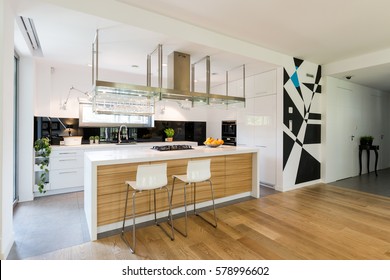 Small Open Kitchen With Wooden Kitchen Island And Fitted Cabinets