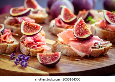 Small open sandwiches with ciabatta, proscuitto and fresh figs as appetizes