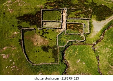 Small Open Sheep Farm In Connemara, Ireland. Traditional Stone Walls And Green Fields. Agriculture Industry. Wool Production. Aerial View.