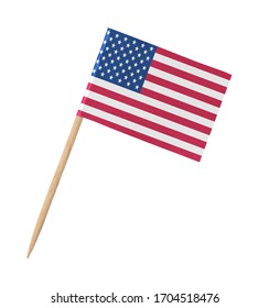 Small paper American flag on wooden stick, isolated on white