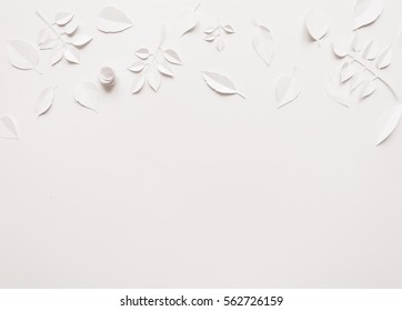 Small Paper Flowers And Leaves On The White Background