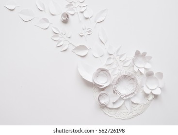 Small Paper Flowers And Leaves On The White Background