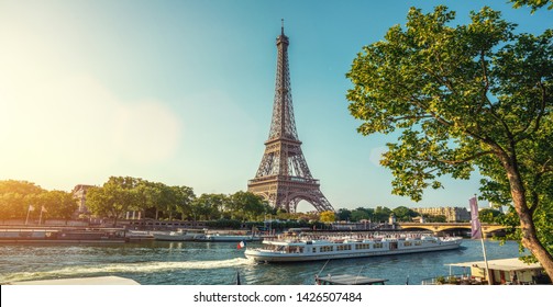 small paris street with view on the famous paris eifel tower on a cloudy rainy day with some sunshine - Shutterstock ID 1426507484