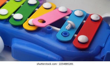 Small parts in a plastic toy that have potential hazards for children under 3 years old. - Shutterstock ID 2254885281