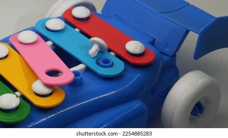Small parts in a plastic toy that have potential hazards for children under 3 years old. - Shutterstock ID 2254885283
