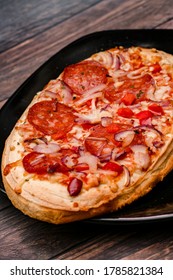 Small Pepperoni Pizza On A Plate