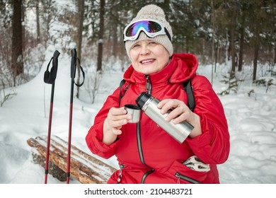 A Small Picnic In The Winter Forest. Grandma Is Drinking Tea.