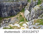 The small and picturesque Saint Govan’s Chapel, nestled between the limestone cliffs along the Pembrokeshire coast of Wales, UK.