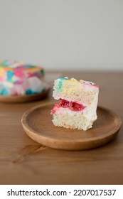 A Small Piece Of Cake On A Wooden Plate