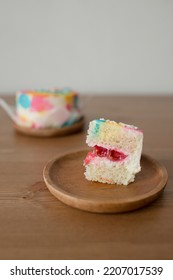 A Small Piece Of Cake On A Wooden Plate