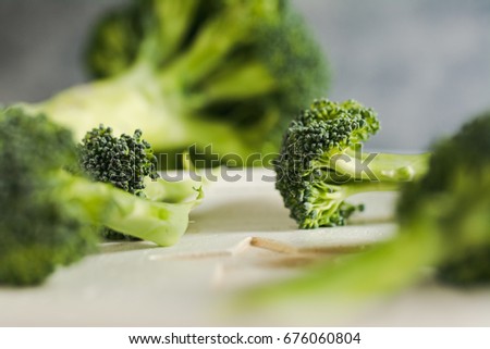 Similar – Small pieces of raw broccoli on white wood, Close up