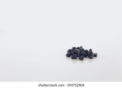 Small Pile Of Black Rocks Macro Isolated