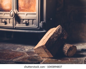 A Small Pile Of Logs By A Wood Burner