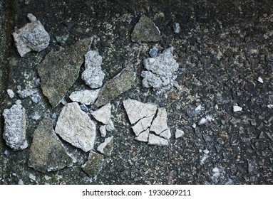 Small Pile Of Rubble And Broken Concrete Or Cement Wall On Stony Ground.