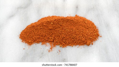 A Small Pile Of Taco Seasoning On A Gray Marble Cutting Board.