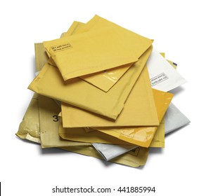 Small Pile Of Yellow Padded Envelopes Isolated On White Background.