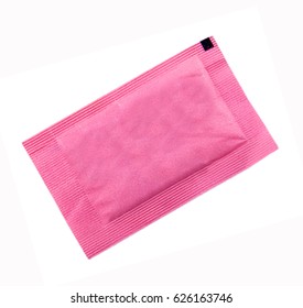 Small Pink Paper Bag With Sugar For Coffee On White Background