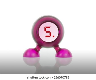 Small pink plastic object with a digital display, displaying 5