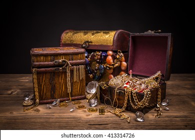 Small pirate treasure chest on wooden table