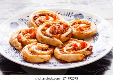 Small Pizza Slugs On A Plate With Puff Pastry