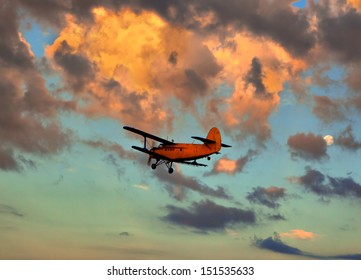 Small Plane Against The Sky On A Decline 