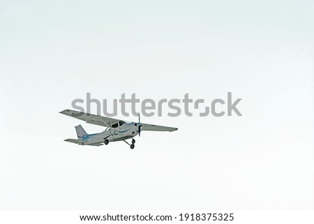Small plane flies in the sky