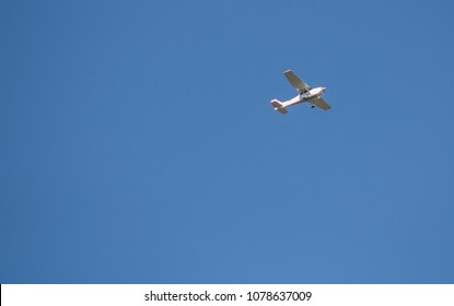 Small Plane Flying Low In The Sky With Space For Text