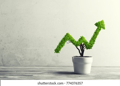 Small plant in pot shaped like growing graph - Shutterstock ID 774376357