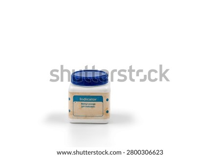 Small plastic bottle labeled methyl orange pH indicator isolated on white background, illustrating laboratory reagent, chemical indicator, pH testing, science education and analytical chemistry.