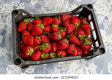 Small Plastic Box With Strawberries On The Table