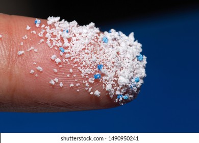 Small Plastic Pellets On The Finger.Micro Plastic.
Air Pollution