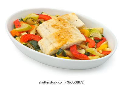 Small Plate Of Inflight Meal, White Fish And Roasted Vegetables On A White Background