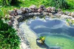 Small Pond In The Garden As Landscaping Design Element.