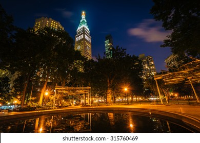 Small Pool And Buildings At Madison Square Park At Night, In Manhattan, New York.