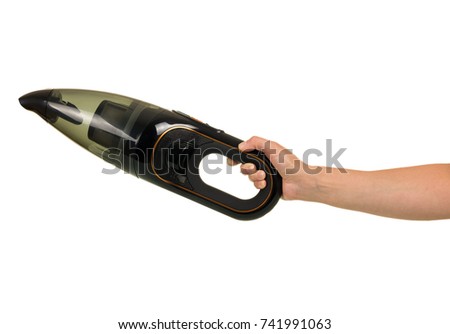 Small portable vacuum cleaner in hand, isolated on white background