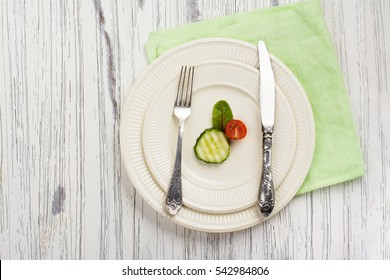 Small Portion Of Food. Anorexia Or Unhealthy Diet Concept. Top View