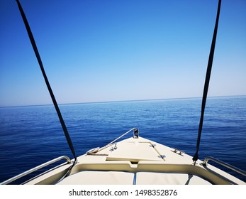 Small Power Boat Facing Horizon Line