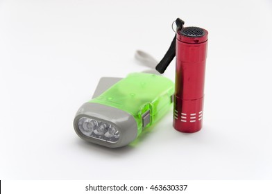 small powerful green and red electric torch isolated on white background, soft focus
