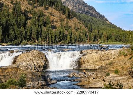 Small but powerful Kootenai Falls and rushing stream in Montana.