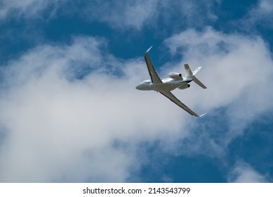 Small Private Jet Airplane Taking Off Overhead