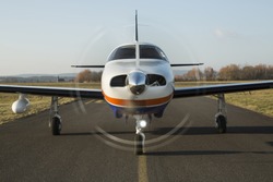 Small Private Single-engine Piston Aircraft On Runway, Front View