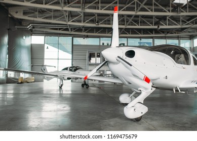 Small Private Turbo-propeller Airplane In Hangar