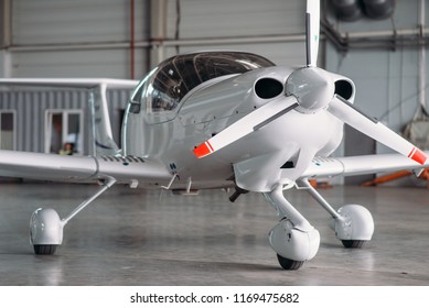 Small Private Turbo-propeller Airplane In Hangar