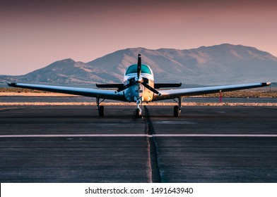 Small Propeller Plane During Moody Sunset On The Reno Airfield In The Desert.