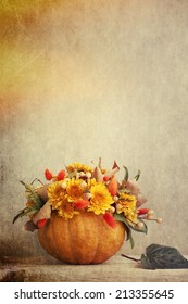 Small pumpkins with chrysanthemums